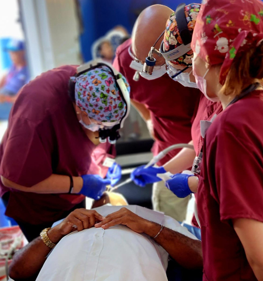 A group of doctors working on a patient