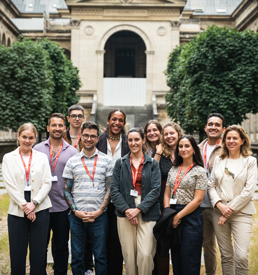 A group of people standing in front of a building