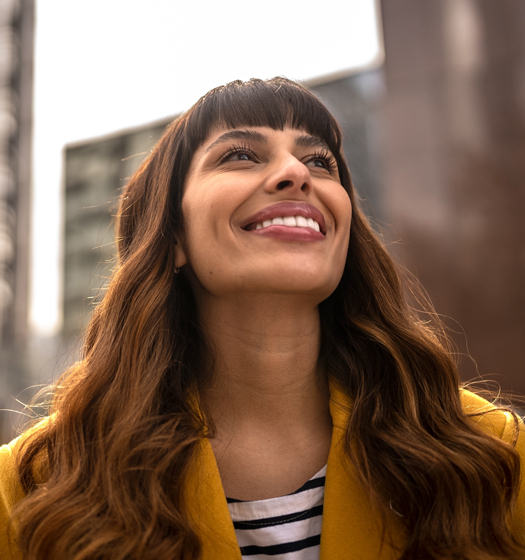 A woman with long hair smiling