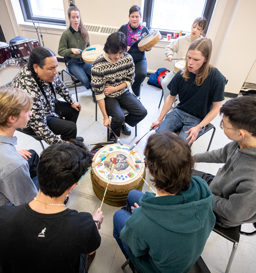 A group of people playing drums